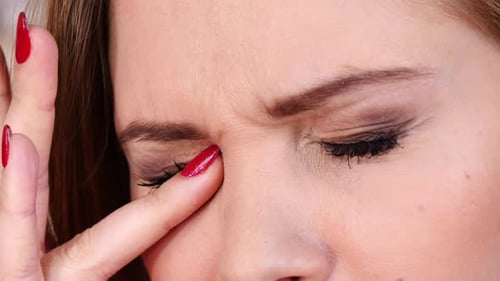Close Up Of Woman Rubbing Her Eyes