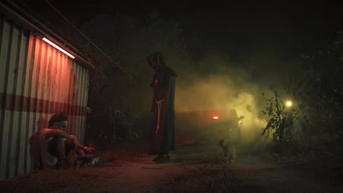 Sinister Encounter: Hooded Figure Threatens Man at Night