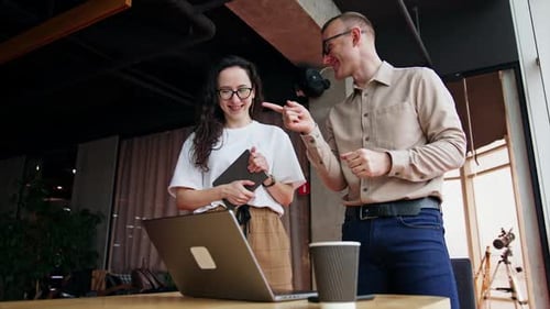 Cheerful office workers in the spacious office.