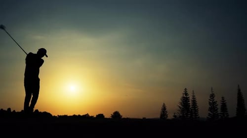 Golfer Swinging at Sunset Silhouette in Nature