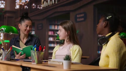 Adult Reading to Children in Library