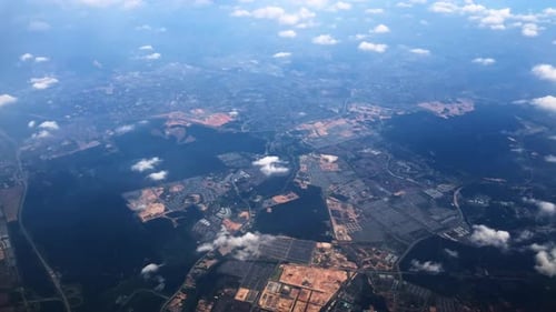 Aerial view of a city landscape with clouds