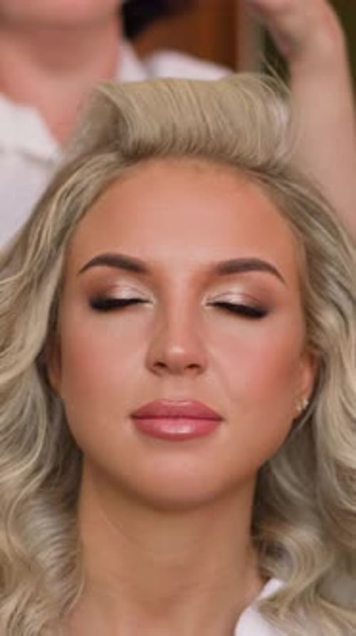 Blonde Woman Getting Hair Styled