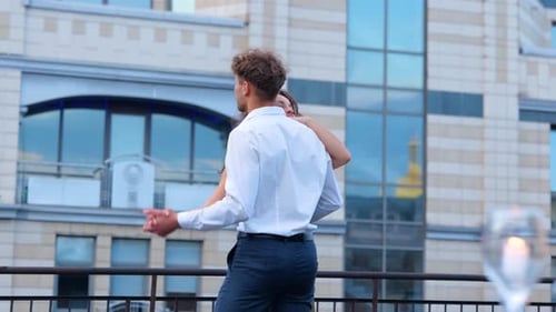 Loving Couple Dancing on City Rooftop