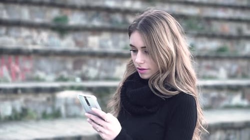 Woman Using Smartphone in Urban Environment