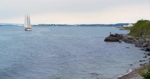 Wooden Sailboat Sailing Along Coast