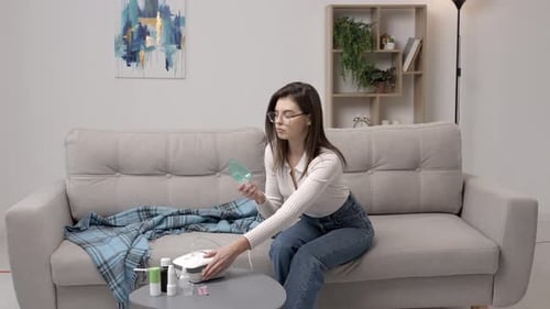 Young Woman Uses Nebulizer at Home for Treatment