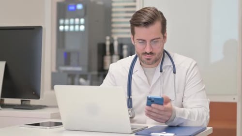Doctor Uses Cell Phone in Office Setting