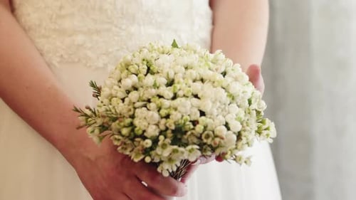 Bride Holding Fresh Wedding Bouquet Close Up