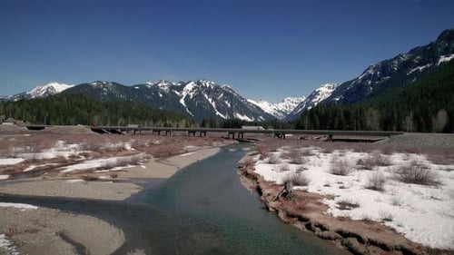 Washington Mountain Highway Aerial Of Trucks Crossing Bridge Over River