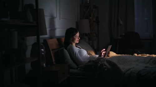 Domestic Woman Touching Tablet Glowing Screen Lying Comfortable Home Bed Night