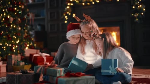 Children Opening Presents on Christmas Morning