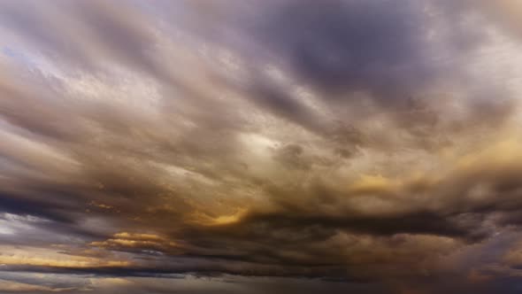 Light rain clouds in the bright summer night reflecting the midnight ...