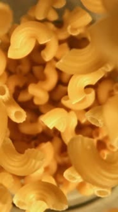 Super Slow Motion Dry Macaroni Pasta Filmed on a Highspeed Camera at 1000 Fps