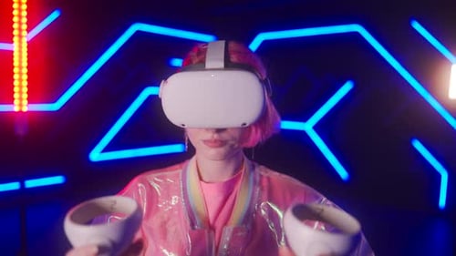 A Young Woman Wearing a VR Helmet and Playing a Game Cyber Player in a Virtual Reality Tournament