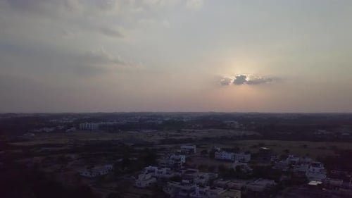 Bird's eye view of beautiful sunset at Tiruppur city during evening in Tamil Nadu, India. Sun covere