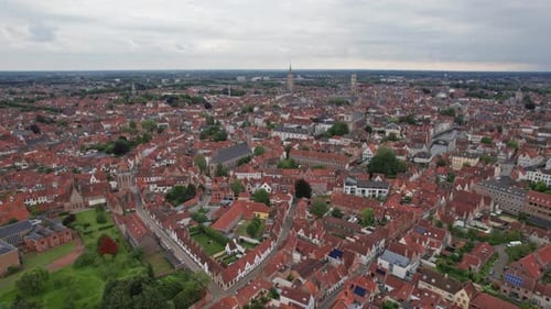 Aerial shot of Bruges in Belgium overlooking the city center and it's churches