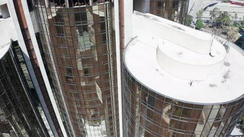 floating down a building side in the daytime in the city