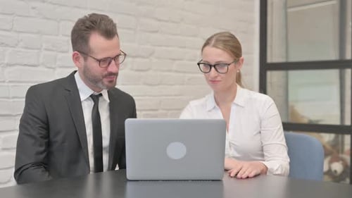 Business Colleagues On Video Call Using Laptop