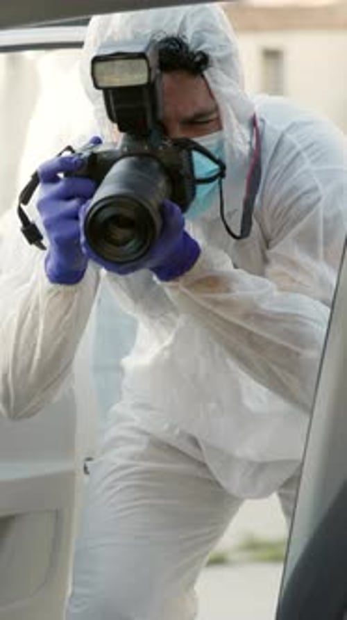 Forensic Photographer Photographs Crime Scene Evidence