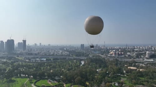 Aerial shot of a hot air balloon over Yarkon Park Tel Aviv, Israel