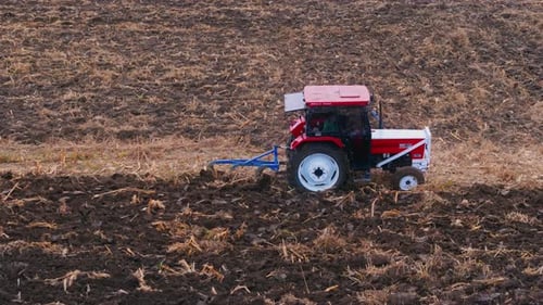 Farm Tractor Plowing Field 4k