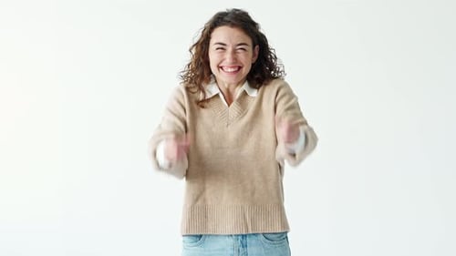 Excited Young Woman Cheering Indoors