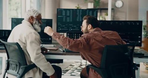 Businessmen, stock market and fist bump with computer in office for finance or investment success