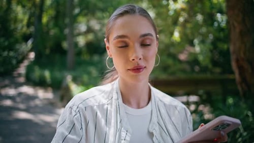 Gorgeous Girl Texting Cellphone Standing Green Nature Close Up Woman Scrolling