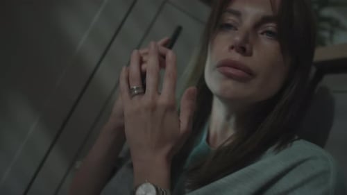 Woman Talking on Mobile Phone Late at Night