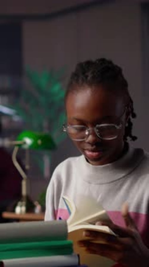 Vertical Video African American Girl Does Bachelor Paper Research for Citations and Information