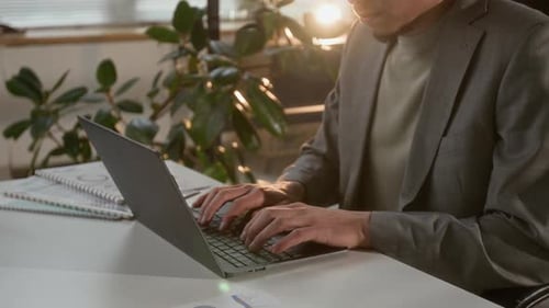 Midsection of Entrepreneur Getting Ready for Business Presentation Using Laptop