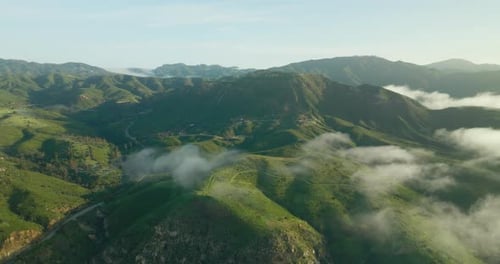 Peaked mountain peak in swirling clouds