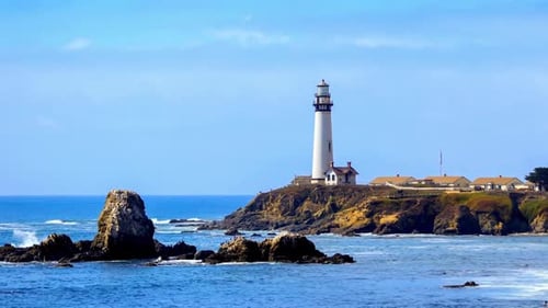 Picturesque Lighthouse on Rocky Cliff Overlooking the Ocean