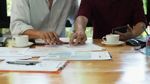 Businessmen financial inspector and secretary calculating balance.