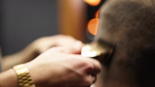 Barber Using Electric Razor for Haircut