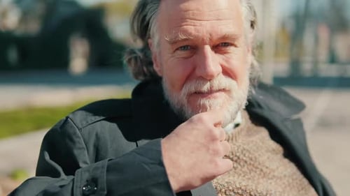 Happy Older Man Smiling in the Park