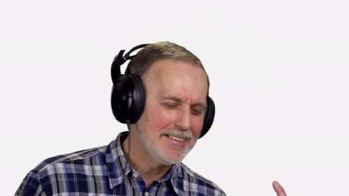 Man Singing Along with Music Using Headphones