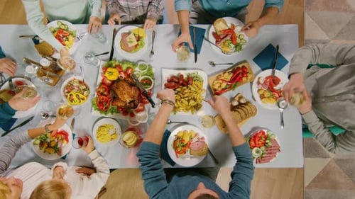 Top View of People Toasting at Festive Table