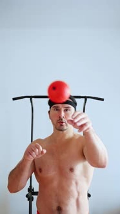 Athletic Juggling Drill Individual Engaging in Quick Reaction Training with Energetic Movements