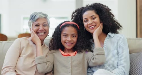 Happy, face and child with mother and grandmother on sofa in the living room of family house