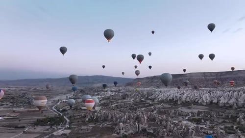 Hot Air Balloons Floating Over Cappadocia Landscape