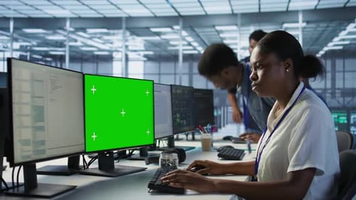 Data Center Technician Using Mockup PC Maintaining Company Network