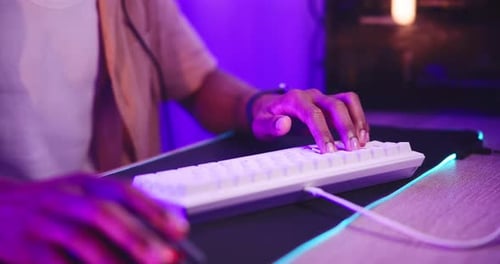 Gamer Playing Video Game in Dark Room