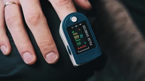 Close Up of Pulse Oximeter on Finger