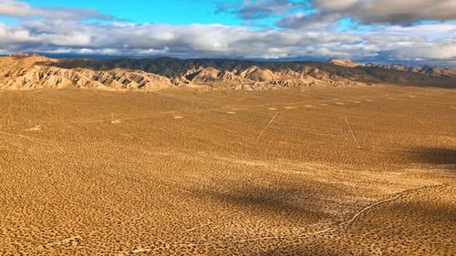 Beautiful scenery of Nevada desert on daytime. Drone footage approaching stunning mountains topped