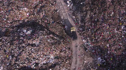 Aerial View of Truck Driving Through a Landfill