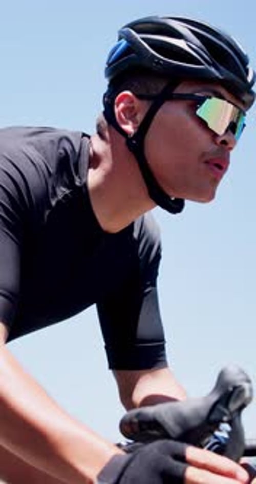 Cycling, hands and man on bike outdoor for practice, competition and exercise on road for journey