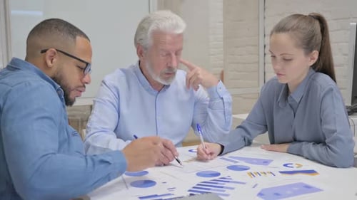 Team Discussing Data Analytics in the Office