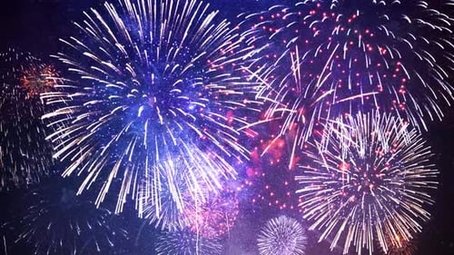 Real Fireworks Explosion on Smoke Foggy Firework in Night Sky